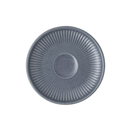 Blue ceramic plate with textured design on a white background