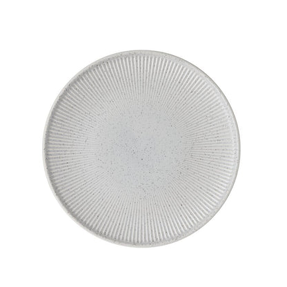 Round textured grey plate on a white background